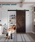 Brown Barn Door 36 Inch By 84 Inch With Six Point Six Foot Barn Door Hardware Track Kit And Handle Included installed indoors