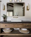 Farmhouse Style 3-Light Mason Jar Wall Sconce With Wood Base And Glass Shades in modern bathroom vanity lighting setup.