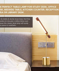 Slim Banker LED Desk Lamp In Wood And Brass Adjustable Arm Modern Table Light next to bed in home office setting