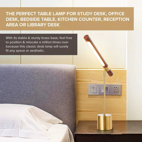 Slim Banker LED Desk Lamp In Wood And Brass Adjustable Arm Modern Table Light next to bed in home office setting