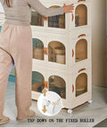 Real Heavy Duty 5 Tier Stackable Storage Cabinet Featuring Magnetic Closure And Rolling Base With Brakes in a home setting, woman organizing fabric bins.