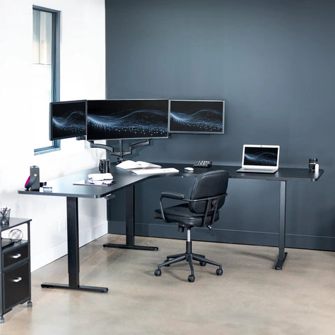 Rock Solid Corner Standing Desk Rig In Matte Black With Lightning Fast Height Adjustments And Split Tabletop Design Built For Zero Fuss Sit To Stand Moves That Totally Level Up Your Home Office with dual monitors and ergonomic chair.