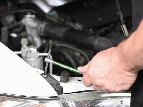 Using 9 Piece Torx T-Handle Spinner Wrench Set with Sliding Grip on car engine, T10 through T50 sizes visible
