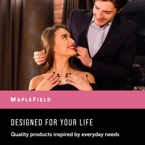 Man helping woman wear necklace with smile, MapleField ad at dinner, highlighting personal touch in jewelry wearing.