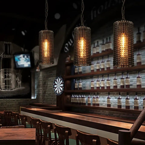 Bar setting with hanging light fixtures showcasing Dimmable Vintage Edison LED Bulb Pack Of 6 With Warm White 2700K Glow.