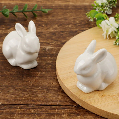 Two Pieces Rabbit Shaped Ceramic Toilet Bolt Covers Set For Bathroom Decor, Cute Bunny Toilet Screw Caps on wooden surface.