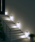 Solar Fence Post Lights Wall Mount Decorative Deck Lighting Black 6 Pack illuminating outdoor stairs with soft honeycomb glow