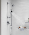 Forte All-In-One Handshower Kit with Slide Bar and 60-Inch Hose, polished chrome, spraying water in modern bathroom.