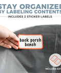 Hand placing label on Two Pack Heavy Duty Clear Plastic Patio Bench Cover For Outdoor Furniture Waterproof And Reusable Extra Thick 4mm Cushion Protector Universal Fit For 58 By 28 By 52.5 Inch Loveseats And Cushions Weatherproof.