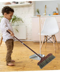 Child using Long Handle Heavy Duty Broom With Soft Beveled Bristles For No Sweat Dust Removal and Quick Corner Cleanup.
