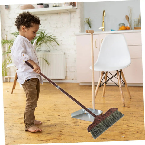 Child using Long Handle Heavy Duty Broom With Soft Beveled Bristles For No Sweat Dust Removal and Quick Corner Cleanup.