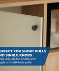 Cabinet door with single knob showing Portable Cabinet Hardware Jig With Edge Guide For Knobs And Small Pulls in use