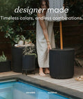 Durable Outdoor Umbrella Side Table With Umbrella Hole For Patio Or Porch beside pool with plants, plastic stone composite