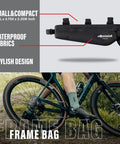 Triangle-style black bike frame bag on a bicycle, showing size 14.5x4.75x2.35 inches, waterproof with 2.6L capacity.