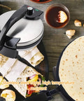 Heavy Duty Electric Tortilla Press 10 Inch Non Stick Roti Maker With Adjustable Heat Control, stainless steel cover and tortillas in use.