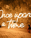 Once Upon A Time Neon LED Light Sign Warm White 15.8 Inch By 8.9 Inch USB Powered 5V on floral wall background.
