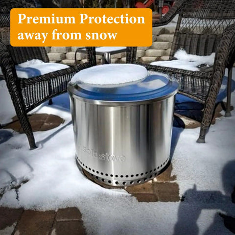 Built Tough 27 Inch Fire Pit Lid Cover With 600D Oxford Fabric Weatherproof Shield for Yukon covering a snow-covered fire pit