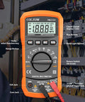 High Sensitivity Digital Multimeter Tester in use, measuring voltage in a control panel with orange casing and LCD display