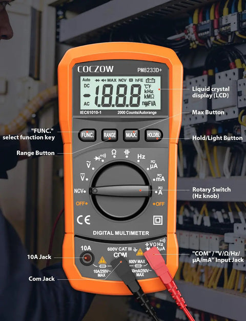 High Sensitivity Digital Multimeter Tester in use, measuring voltage in a control panel with orange casing and LCD display