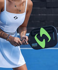 Player holding G3 Powerband Pickleball Paddle With 16mm Core, Carbon Fiber Face, UniFrame Molded Design, on court