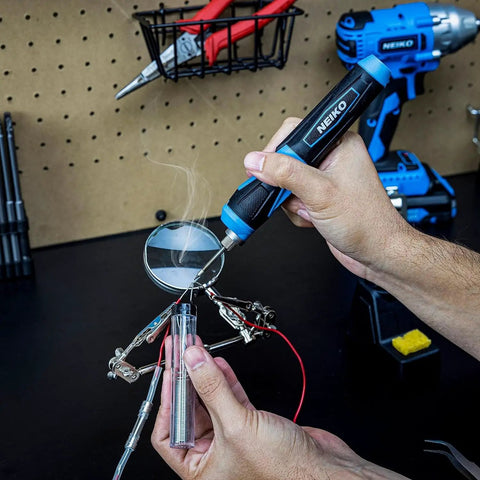 Cordless Wireless Soldering Kit with Mini USB Rechargeable Pen, LED Indicator, in use on electronics workbench for DIY projects.