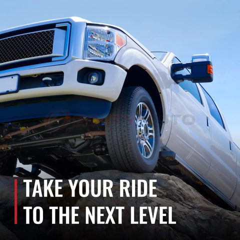 White truck on rocky terrain with text 'Take Your Ride to the Next Level'