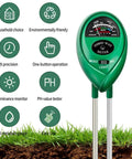 Close-up of a 3 In 1 Soil Moisture Light And PH Tester in lawn, showing moisture, light, and pH gauge for home garden and farm use.