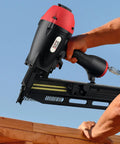 Man using 21 Degree Full Round Head Framing Nailer With 2 Inch To 3 And A Half Inch Nails Tool Free Depth Adjustment 360 Degree Exhaust