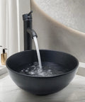 Dope Matte Black Vessel Sink Set With Faucet And Pop Up Drain, 12.8 Inch Round Ceramic Above-Counter Bathroom Sink filled with water
