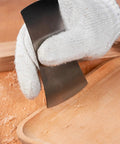 Top Shelf Six Piece Cabinet Scraper And Burnisher Kit With Blue Spring Steel Blades Plus Hardened High Speed Steel Sharpening Rod For Knockout Woodworking Finishes Daily, hand using scraper on wood.