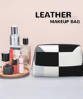 Hella Chic Black And White Piano Key Print Travel Makeup Bag, Durable PVC Cosmetic Pouch For Women, with beauty products.