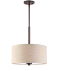Three Light Pendant In Bronze Finish With Beige Drum Shade, A 35 Inch Tall And 14.5 Inch Wide Fixture, UL Listed For Dry Locations