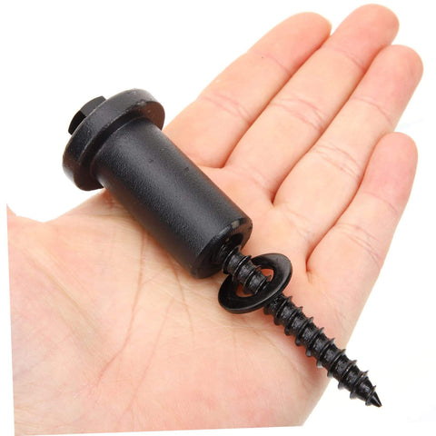 Hand holding a black spacer with screw from Sliding Barn Door Track Spacer Kit 4 Pack Connectors For Reliable Door Repair Easy To Install With Heavy Duty Carbon Steel Hardware And Adjustable Wall Clearance.