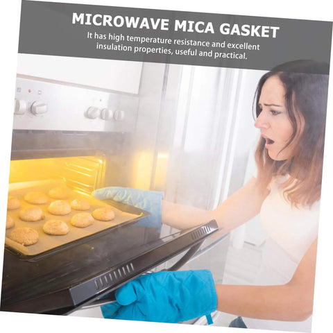 Woman using oven with Set Of 10 Mica Sheets For Microwave Oven Waveguide Insulation Heat Resistant Kitchen Must Have Accessory