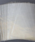 500 Pcs 4X6 Inch Polyolefin Heat Shrink Film Wrap Flat Bags With Vent Hole stacked on gray background.