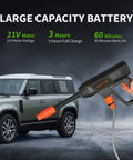 Cordless Pressure Washer 940 PSI Portable Heavy Duty Power Cleaner with Six In One Adjustable Nozzle and 21V 4.0Ah Battery next to SUV