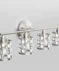 Four Light Brushed Nickel Vanity Light Over Mirror With Cylinder Crystal Shades mounted on wall