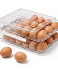 Stackable Fridge Egg Dispenser With Rolling Auto Dispense Holds 36 Eggs, clear 2-layer holder with eggs visible inside and outside.