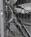 Close-up of Boss Level Industrial Exhaust Fan features six blade turbine design with protective grid for safety.