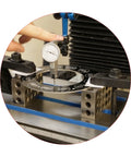 Front view of HFS 1-2-3 machinist blocks with a circular 23-hole ring, dial indicator measuring setup on metal base