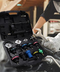 Hassle Free 16 Piece Universal Radiator Pressure Tester Kit With 13 Heavy Duty Adapters arranged in a car maintenance setting.