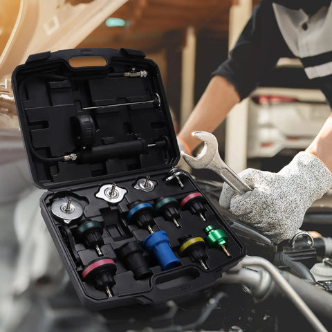 Hassle Free 16 Piece Universal Radiator Pressure Tester Kit With 13 Heavy Duty Adapters arranged in a car maintenance setting.