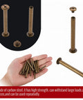 Heavy Duty Chicago Binding Screws Featuring Phillips Head Nuts For Rock Solid Leather Crafting And Scrapbooks Hella Simple Quick Swap Bronze Steel Posts Great For Diy Makers Looking For Snappy Reliable Fasteners In A 50 Piece Lot displayed in hand and on dark background.