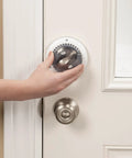 Hand installing Secure Mount Deadbolt Lock For Kid Safe Home Use No Adhesive Needed Behind Existing Hardware Dual Action System, white finish.