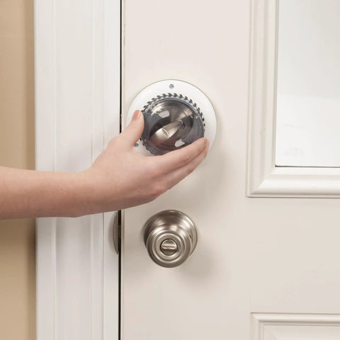 Hand installing Secure Mount Deadbolt Lock For Kid Safe Home Use No Adhesive Needed Behind Existing Hardware Dual Action System, white finish.