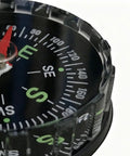 Close-up of dial on Water Resistant Hiking Compass With Lensatic Bearing Guide showing cardinal directions.