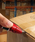 Auto Retracting Utility Knife With Dual Safety System For Fast Box Cutting Blade Auto Retracts When Off The Cutting Surface No Brainer Safety Push Button Release Easy Grip Handle Ideal For DIY Packing And Heavy Duty Work cutting cardboard box