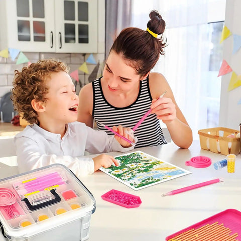 All In One Diamond Painting Tools And Accessories Storage Kit 111Pcs 5D Set in use by a woman and child, pink tool box visible