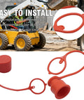 Three Pack Three Quarter Inch Flat Face Hydraulic Quick Coupler Dust Caps and Plugs Red Rubber Skid Steer Coupling Covers Replacement for Bobcat and Other Compatible Equipment shown next to skid steer on construction site.