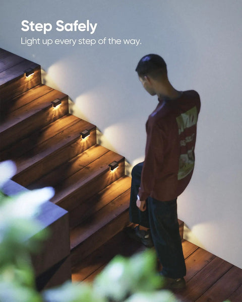 16 Pack Solar Deck Lights For Stairs And Fences Setting Those Sweet Backyard Vibes With A Dang Nice Warm White Glow Plus No Sweat Mounting And Zero Electric Bills To Level Up Your Weatherproof Yard illuminating wooden stairs at night.